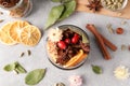 Aromatic potpourri in glass jar on light table, flat lay