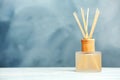 Aromatic reed freshener on table