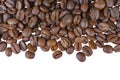 Aromatic roasted arabica coffee beans close up, macro isolated on white background. Royalty Free Stock Photo