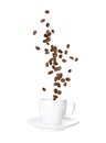Aromatic roasted coffee beans falling into cup on white background Royalty Free Stock Photo