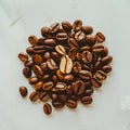 Aromatic roasted coffee beans scattered on a white background Royalty Free Stock Photo