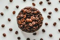 Aromatic roasted coffee beans scattered on a white background Royalty Free Stock Photo