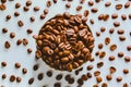 Aromatic roasted coffee beans scattered on a white background Royalty Free Stock Photo