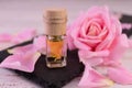 Aromatic rose oil. Bottle of rose essential oil . Royalty Free Stock Photo