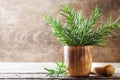 Fresh aromatic rosemary in mortar bowl for cooking