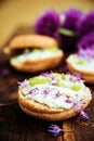 Aromatic sandwich with egg, mackerel and edible flowers of chives