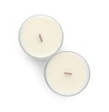 Aromatic soy candles with wooden wicks on white background, top view Royalty Free Stock Photo