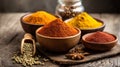 Aromatic Spice Selection Displayed in Wooden Bowls on Rustic Surface Royalty Free Stock Photo