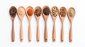 Aromatic Spices Held by Wooden Spoons on White Background Royalty Free Stock Photo