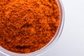 Aromatic spicy chili powder on a white background