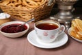 Aromatic tea and cherry jam on table Royalty Free Stock Photo