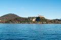 Arona lakeside , Piedmont, with a view of the Rocca di Angera, Lombardy, Lake Maggiore Royalty Free Stock Photo