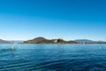 Arona lakeside , Piedmont, with a view of the Rocca di Angera, Lombardy, Lake Maggiore Royalty Free Stock Photo