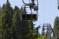 Arosa, Switzerland, August 15, 2021 Chair lift overhead some trees