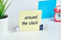 Around the clock - english idiom hand lettering on wooden blocks