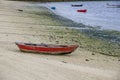 Small fishing boats beached in the sand in Galicia Spain