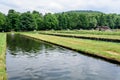 Arpasu de Sus, Sibiu, Romania, 16 July 2021: Landscape with Albota Trout Farm Pastravaria Albota in a sunny summer day