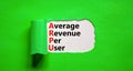 ARPU average revenue per user symbol. Concept words ARPU average revenue per user on white paper on beautiful green background.