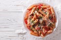 Arrabiata pasta penne with Parmesan cheese. Horizontal top view Royalty Free Stock Photo