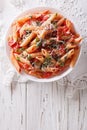 Arrabiata pasta penne with Parmesan cheese. vertical top view Royalty Free Stock Photo
