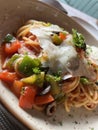 Arrabiata spaghetti with green bell pepper, tomato, and basil on top Royalty Free Stock Photo