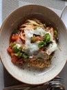 Arrabiata spaghetti with green bell pepper, tomato, and basil on top Royalty Free Stock Photo