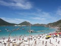 Arraial do Cabo - Beach with blue water, white sand and people sunbathing