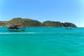 ARRAIAL DO CABO, RIO DE JANEIRO, BRAZIL- MARCH 21, 2016: A boat over a green and clear waters near a coast. Royalty Free Stock Photo