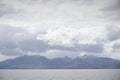 Arran viewed from Rothesay in Isle of Bute under dark clouds Royalty Free Stock Photo