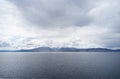 Arran viewed from Rothesay in Isle of Bute under dark clouds Royalty Free Stock Photo