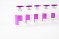 Arrange label purple vial on white background