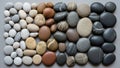 Arranged collection of smooth rounded pebbles varying in size Royalty Free Stock Photo