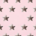 Arranged five silver gummy toy star. Pink background. Minimal design. Copy space. Flat lay. Pattern Royalty Free Stock Photo