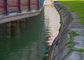 Arranged lake shore and wooden building on pillars, closeup