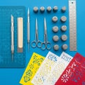 Arranged neatly on a blue background. Items include precision Royalty Free Stock Photo