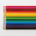 Arranged set of colored pencils displayed horizontally on a white Royalty Free Stock Photo