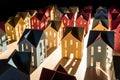 arranged toy houses showing lengthened shadows