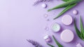 Arrangement of aloe skincare products, delicate containers set with aloe vera leaves, pastel lavender background