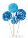 Arrangement of blue lollipops on sticks includes swirl, solid, and striped patterns on a white background Royalty Free Stock Photo