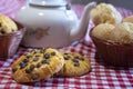 Arrangement with breads, sweets and teapot on a red and white towel Royalty Free Stock Photo