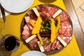 Arrangement of Delicatessen Cold Cuts with red wine and Smoked Ham finocchiona Royalty Free Stock Photo