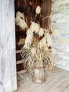 Dried flower arrangement in Shaker Stone Barn doorway Royalty Free Stock Photo