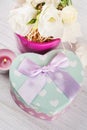 Arrangement of eustoma flowers in pot, pastel gift box Royalty Free Stock Photo