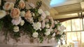 arrangement of flowers in the presidium of the bride and groom at a wedding in a restaurant