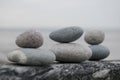 Arrangement of grey pebbles on a coastal wall at the beach Royalty Free Stock Photo