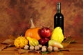 Arrangement of pumpkins, autumn fruits and wine Royalty Free Stock Photo