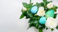Arrangement of rose flowers with multi-colored Easter eggs Royalty Free Stock Photo