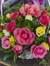 Arrangement of roses in a basket placed in market stall Royalty Free Stock Photo