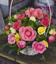 Arrangement of roses in a basket placed in market stall Royalty Free Stock Photo