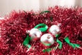 Arrangement of Silver Christmas Ornaments and Ribbon on Garland